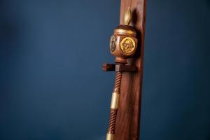 University Mace made of wood and metal with engraved symbols on top